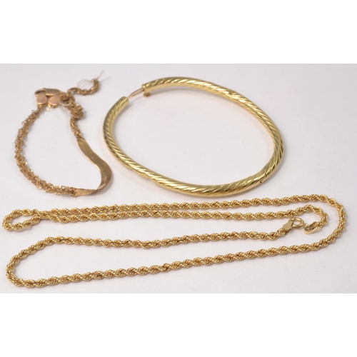 28 - A 10k stamped gold bracelet 6.21g, a rope twist necklace stamped 10k 3.10g Length 46cm, a 10k stampe... 