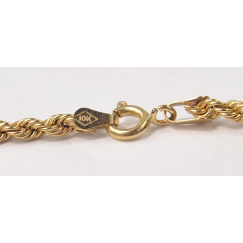 28 - A 10k stamped gold bracelet 6.21g, a rope twist necklace stamped 10k 3.10g Length 46cm, a 10k stampe... 