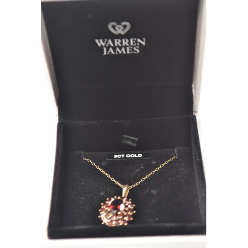 33 - 9ct GOLD pendant and chain set with Garnets