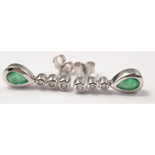 35 - 750 white gold stamped pair of earrings with emeralds and small diamonds 3.56g gross, ex-purchased i... 