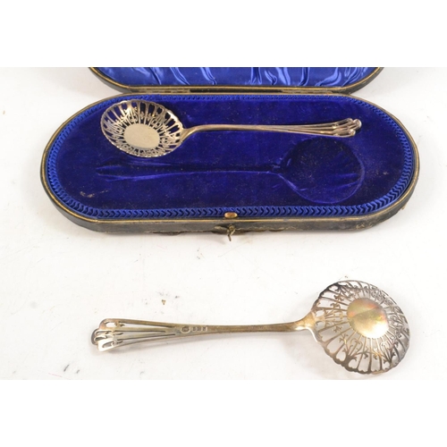 108 - Pair of London Silver slotted serving spoons with pierced design in fitted case (spoons 20cm)