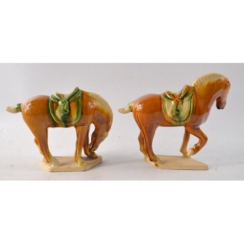 113 - A pair of Oriental Tang style war ceramic horses both with seal mark to base, tallest 13.5cm in heig... 