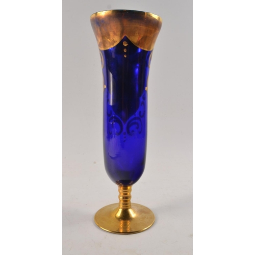 122 - Ornate blue glass hand painted 21cm Height