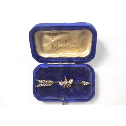 134 - A Victorian old cut diamond bar brooch, with butterfly design, set in silver, gold backed in the sha... 