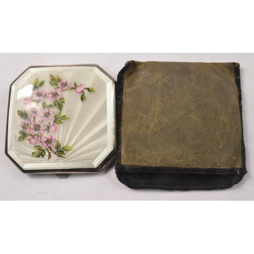 144 - Birmingham silver compact with white enamel front and wild rose design. Comes with fitted soft case.... 