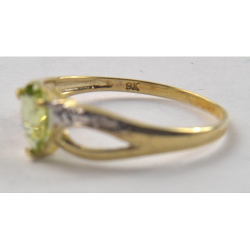 171 - 375 stamped (9ct gold) ring set with pear shaped peridot and 2 small diamonds. Size O. In ring box