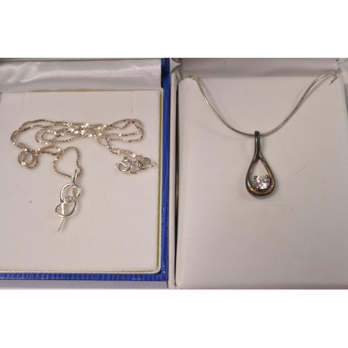 21 - Two 925 stamped silver necklaces one with a white stone gross weight 8.50g approx