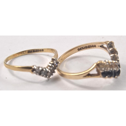 25 - Two ladies 9ct gold wishbone design rings. One set with 2 rows of stones, 1 clear other black (size ... 