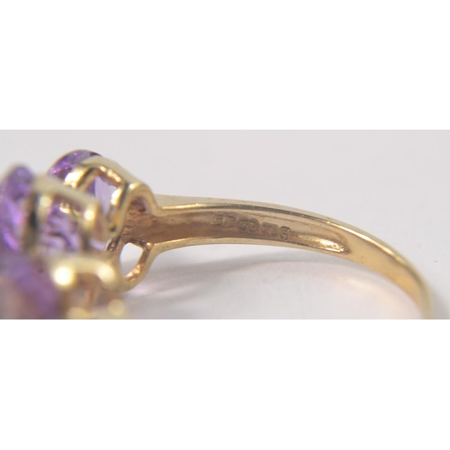 27 - 9ct Yellow gold pale Amethyst 3 stone ring. size P [2.75grm]