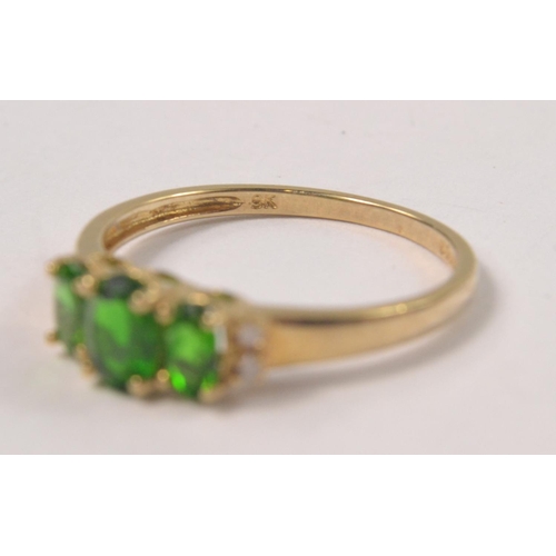 33 - 9K Yellow gold ring set with 3 oval green stones and diamond shoulders. Size P [1.6grms]