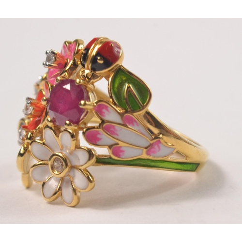 36 - Gilded 925 stamped ring, set with enamel styled flowers and a butterfly and ladybird Size Q