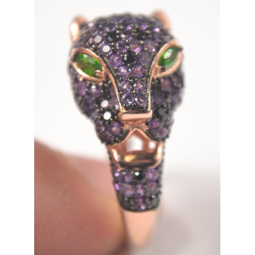 40 - Gilded 925 stamped silver ring in leopards head design, set with oval green stone eyes and amethyst ... 