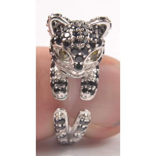 43 - 925 Silver stamped ring, designed as a cat set with black CZ stones. Size P