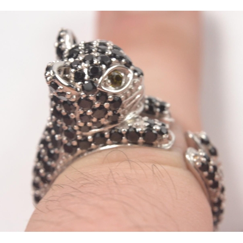 43 - 925 Silver stamped ring, designed as a cat set with black CZ stones. Size P