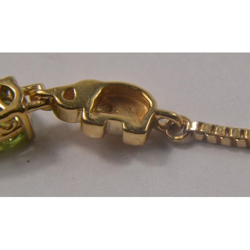 47 - Yellow metal bracelet set with 4 pale green stones seperated by 5 small yellow metal elephants. [7.6... 