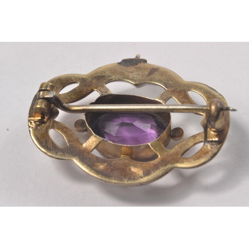 96 - Vintage 'yellow metal' and amethyst brooch - nice quality!