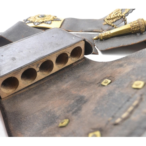 109 - Very old Military belt with 'Now or Never' motto and 3 in trumpet emblem, with matching musket ball ... 