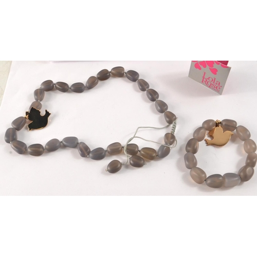 12 - Smokey grey LOLA ROSE necklace and bracelet, with bird charm attached to both pieces. Never worn and... 