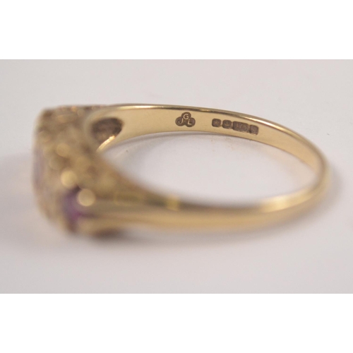 155 - Ladies 375 stamped yellow gold ring set with three rubies and two small diamonds