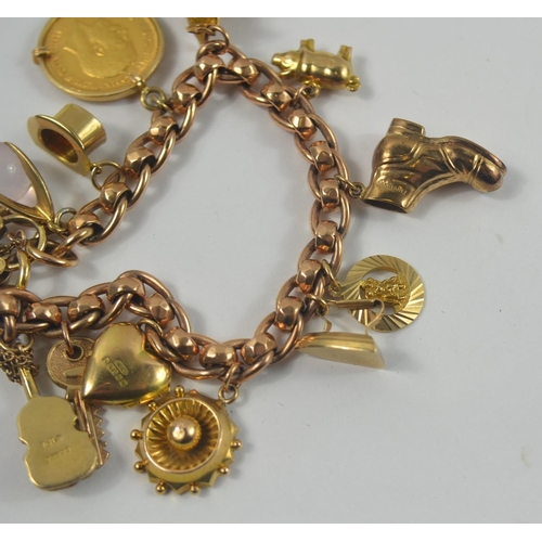 160 - A nice gold charm bracelet, filled with charms. Chain is 375 stamped gold with 12 charms, one a moun... 