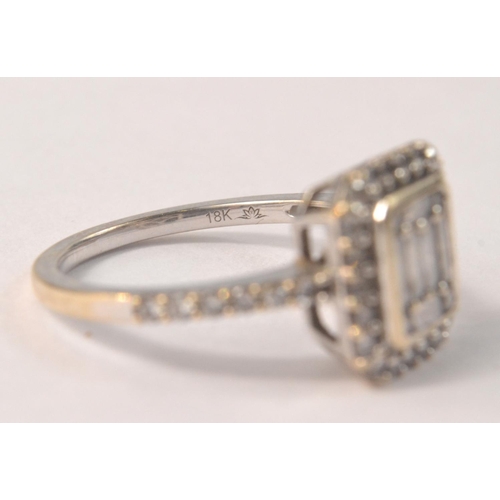 29 - 18K stamped white gold ring set with baguette cut diamonds, size N/O. Comes with diamond certificate... 