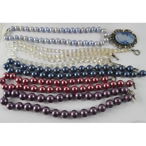 33 - Four sets of vintage coloured faux pearls and two other clear stone necklaces