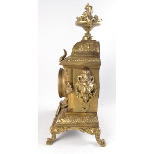 342 - 19th Century brass mantle clock with enamel dial and scrolling and leaf decoration by Challie Burtey