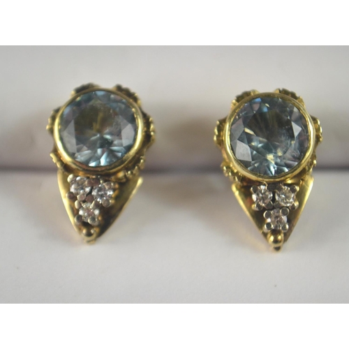 37 - 1XK stamped 9 carat South African yellow gold stud earrings with 3 small diamonds (tested) inset in ... 