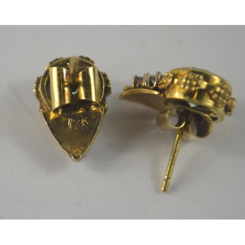 37 - 1XK stamped 9 carat South African yellow gold stud earrings with 3 small diamonds (tested) inset in ... 