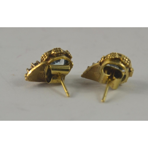 37 - 1XK stamped 9 carat South African yellow gold stud earrings with 3 small diamonds (tested) inset in ... 