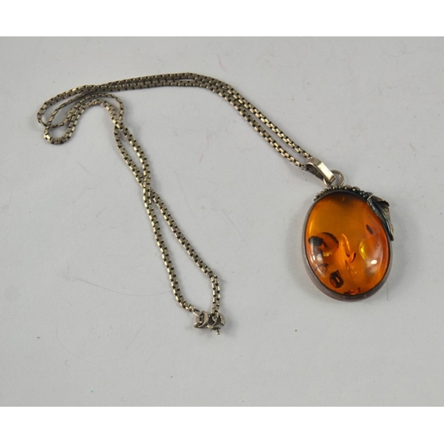 41 - A 925 stamped silver ART NOUVEAU inspired brooch on a 925 stamped silver chain with a large  amber s... 