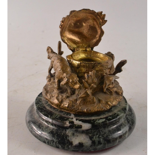 67 - Unusual inkwell with bronzed hunting dog on the prowl on a marble base. Liner not included