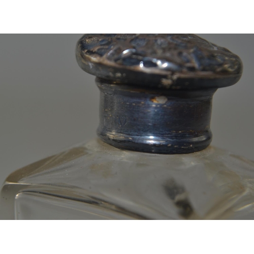 69 - Two London silver topped boudoir bottles