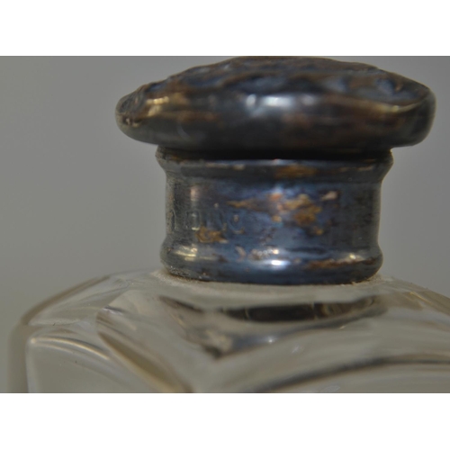 69 - Two London silver topped boudoir bottles