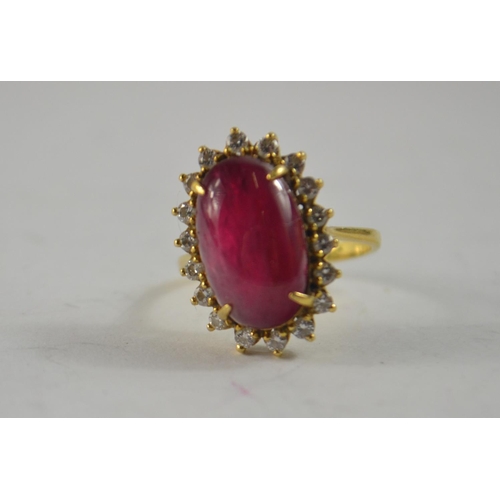 73 - Oval Cabochon ruby and diamond cluster ring, tested as 18ct 15.9 x 9.7 x 6.88mm 7.31g gross weight r... 