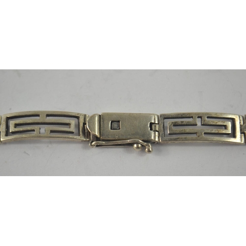 79 - 830 stamped silver Greek key design bracelet 18cm Length, with a vintage white metal/ rubbed Hallmar... 