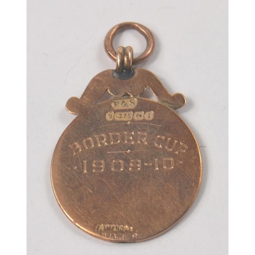 27 - 1910 inscribed BORDERS CUP 375 gold stamped Medallion by Peebles Jeweller by J Dodds Jeweller No 7 E... 