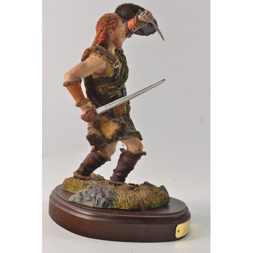 286 - A Holland Studio Crafed  Sworded Highlander on a wooden plynth