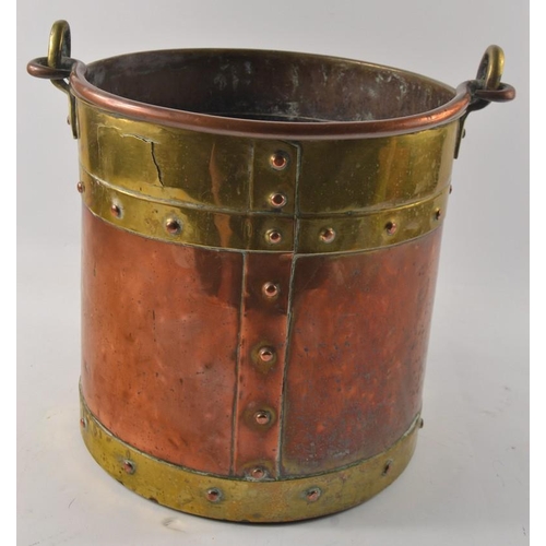 320 - A Victorian copper and brass trim fireside coal bucket