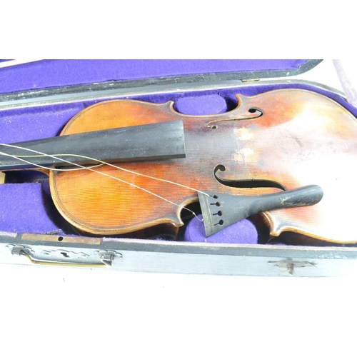 410 - Violin with Stradivarius? label, with bows and case in need of tlc