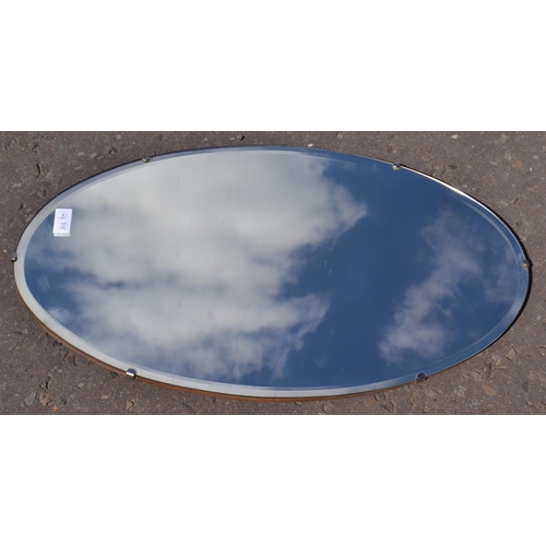 425 - C1950s medium sized oval wall mirror