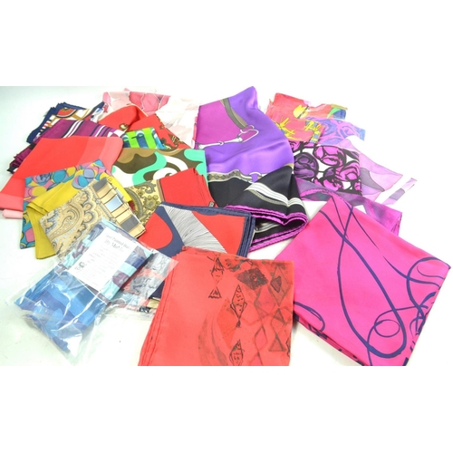 92 - A beautiful lot to include 23 silk scarves all unworn and in new condition to include designers such... 