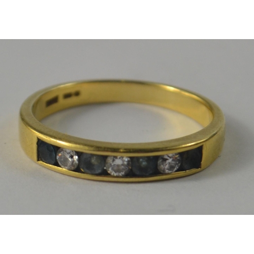 1 - A 750 stamped yellow gold half eternity ring, set with aqua marines and Three lovely diamonds custom... 