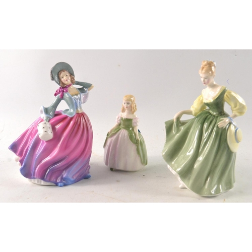 216 - THREE DOULTON figurines to include PENNY, FAIR LADY AND AUTUMN BREEZE