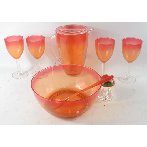 226 - A classy designer punch jug  (2 pint approx)and bowl with 4 wine goblets and spoon in a two tone ora... 