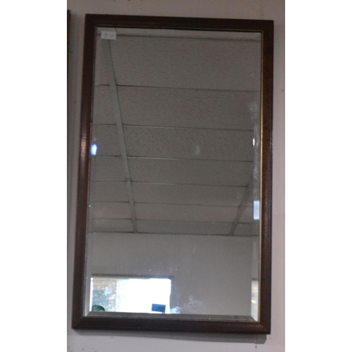 281 - A mahogany wall mirror with bevel edge