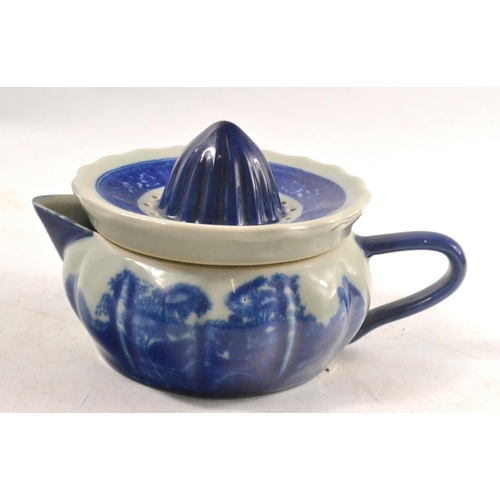 294 - A VICTORIA WARE iron stone vintage juicer in blue and white glaze pattern