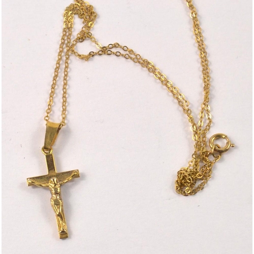 5 - 9ct stamped yellow gold crucifix pendant with chain