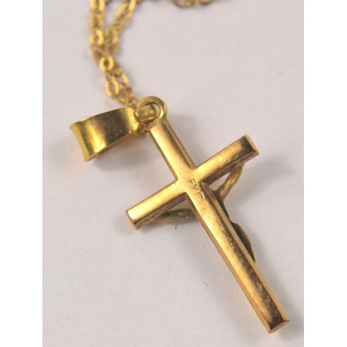 5 - 9ct stamped yellow gold crucifix pendant with chain