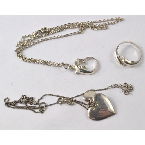 7 - Three silver 925 stamped jewellery pieces to include a dolphin pendant necklace and matching ring